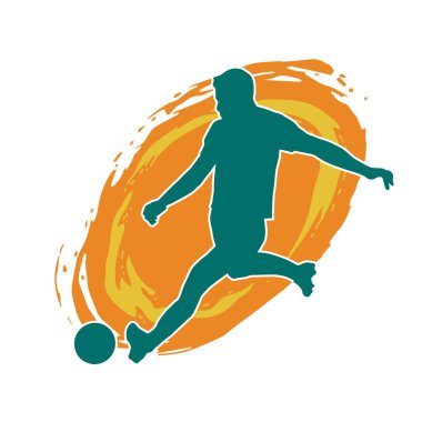 Top tekmeleyen bir erkek futbolcunun silueti. Hareket halindeki bir futbolcunun silueti.