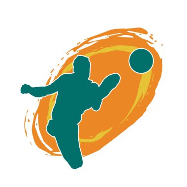 Top tekmeleyen bir erkek futbolcunun silueti. Hareket halindeki bir futbolcunun silueti.