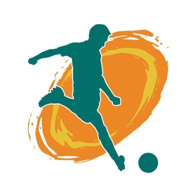 Top tekmeleyen bir erkek futbolcunun silueti. Hareket halindeki bir futbolcunun silueti.