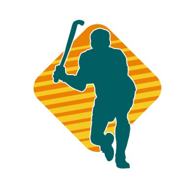 Erkek çim hokeyi atletinin silueti iş başında. Çim hokeyi oynayan bir adamın silueti..