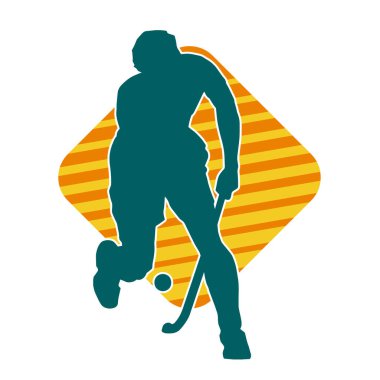 Erkek çim hokeyi atletinin silueti iş başında. Çim hokeyi oynayan bir adamın silueti..