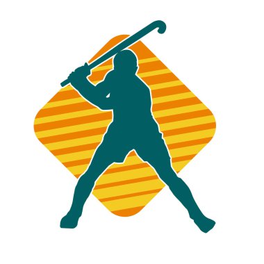 Erkek çim hokeyi atletinin silueti iş başında. Çim hokeyi oynayan bir adamın silueti..