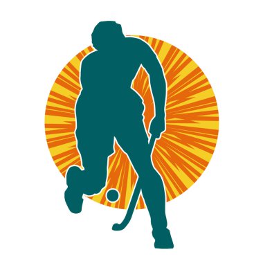 Erkek çim hokeyi atletinin silueti iş başında. Çim hokeyi oynayan bir adamın silueti..