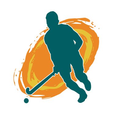 Erkek çim hokeyi atletinin silueti iş başında. Çim hokeyi oynayan bir adamın silueti..