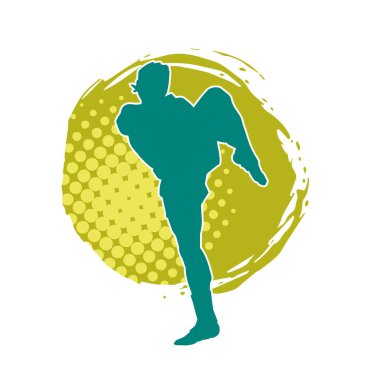 Hareketli erkek kickboksör atletinin silueti. Tekme atan bir adamın silueti..