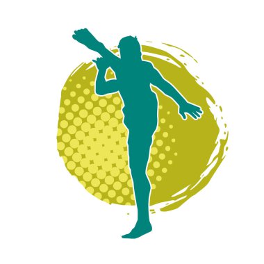 Dövüş sanatları pozu veren bir erkeğin silueti. Dövüş sanatları ustasının silueti tekme atma pozu veriyor..