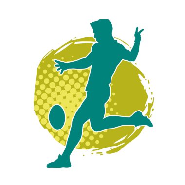 Rugby sporcusunun silueti iş başında. Rugby oynayan sporcu bir adamın silueti..