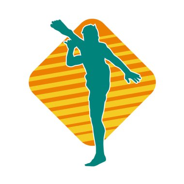 Dövüş sanatları pozu veren bir erkeğin silueti. Dövüş sanatları ustasının silueti tekme atma pozu veriyor..