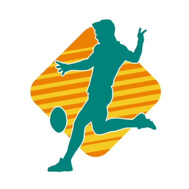 Rugby sporcusunun silueti iş başında. Rugby oynayan sporcu bir adamın silueti..