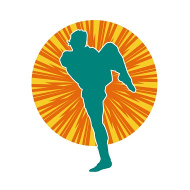 Hareketli erkek kickboksör atletinin silueti. Tekme atan bir adamın silueti..