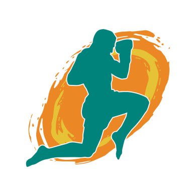 Hareketli erkek kickboksör atletinin silueti. Tekme atan bir adamın silueti..