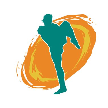 Hareketli erkek kickboksör atletinin silueti. Tekme atan bir adamın silueti..