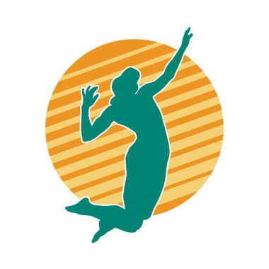 Hareketli bir kadın voleybol oyuncusunun silueti. Voleybol oynayan bir kadının silueti..
