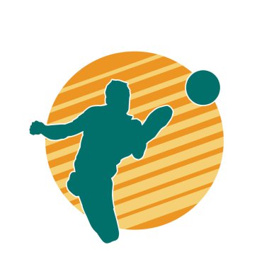 Top tekmeleyen bir erkek futbolcunun silueti. Hareket halindeki bir futbolcunun silueti.