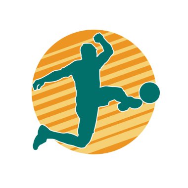 Top tekmeleyen bir erkek futbolcunun silueti. Hareket halindeki bir futbolcunun silueti.