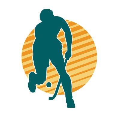 Erkek çim hokeyi atletinin silueti iş başında. Çim hokeyi oynayan bir adamın silueti..