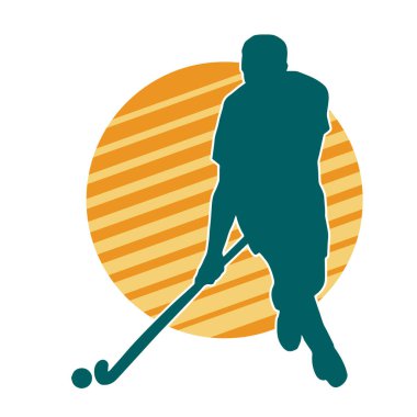 Erkek çim hokeyi atletinin silueti iş başında. Çim hokeyi oynayan bir adamın silueti..