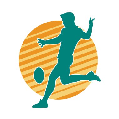 Rugby sporcusunun silueti iş başında. Rugby oynayan sporcu bir adamın silueti..