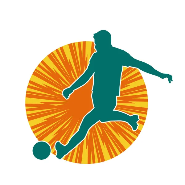 Top tekmeleyen bir erkek futbolcunun silueti. Hareket halindeki bir futbolcunun silueti.