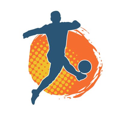 Top tekmeleyen bir erkek futbolcunun silueti. Hareket halindeki bir futbolcunun silueti.