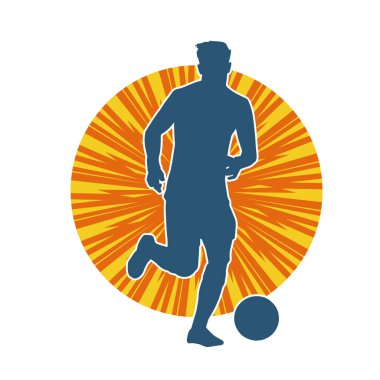 Top tekmeleyen bir erkek futbolcunun silueti. Hareket halindeki bir futbolcunun silueti.