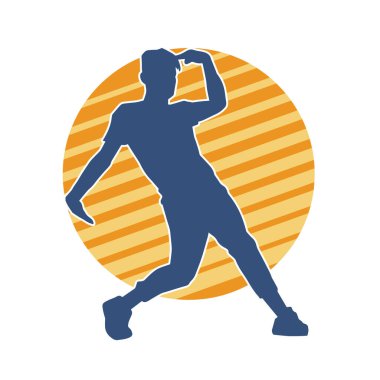 Hareket halindeki bir erkek dansçının silueti. Dans eden zayıf bir adamın silueti..