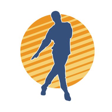 Hareket halindeki bir erkek dansçının silueti. Dans eden zayıf bir adamın silueti..