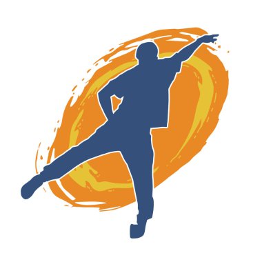 Hareket halindeki bir erkek dansçının silueti. Dans eden zayıf bir adamın silueti..