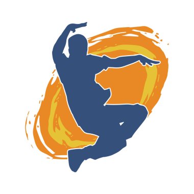 Hareket halindeki bir erkek dansçının silueti. Dans eden zayıf bir adamın silueti..