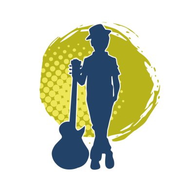 Akustik gitarlı genç bir çocuğun silueti. Akustik gitar enstrümanı olan genç bir müzisyenin silüeti..