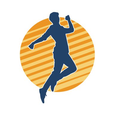 Hareket halindeki bir erkek dansçının silueti. Dans eden zayıf bir adamın silueti..