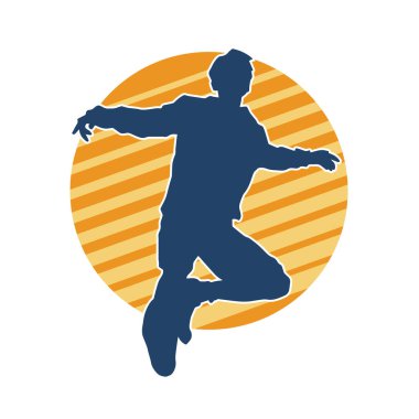 Hareket halindeki bir erkek dansçının silueti. Dans eden zayıf bir adamın silueti..