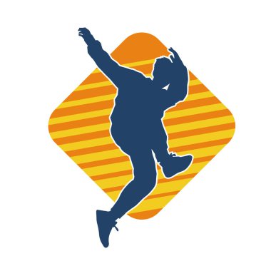 Hareket halindeki bir erkek dansçının silueti. Dans eden zayıf bir adamın silueti..