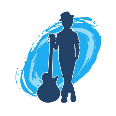 Akustik gitarlı genç bir çocuğun silueti. Akustik gitar enstrümanı olan genç bir müzisyenin silüeti..