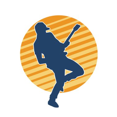 Elektro gitar çalan bir müzisyenin silueti. Bir erkek gitaristin silueti.