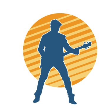 Elektro gitar çalan bir müzisyenin silueti. Bir erkek gitaristin silueti.