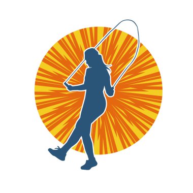 Zayıf, sportif bir kadının silüeti ip atlama egzersizi yapıyor..