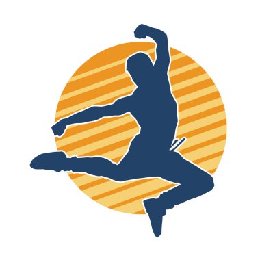 Sportif bir adamın silueti atlıyor. Dansçı bir erkeğin silueti hareket halinde..