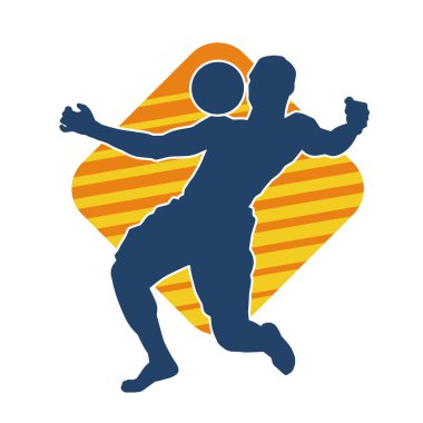 Top oynayan kaslı bir adamın silueti. Top oynayan atletik vücutlu bir erkeğin silueti..