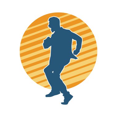 Hareket halindeki bir erkek dansçının silueti. Dans eden zayıf bir adamın silueti..