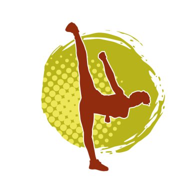 Dövüş sanatları tekmesi atan bir kadının silueti. Sportif bir kadının silueti tekme hareketi yapıyor..