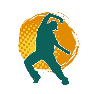 Hareket halindeki bir erkek dansçının silueti. Dans eden zayıf bir adamın silueti..