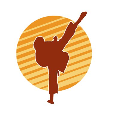 Dövüş sanatları tekmesi atan bir kadının silueti. Sportif bir kadının silueti tekme hareketi yapıyor..