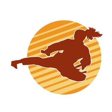Dövüş sanatları tekmesi atan bir kadının silueti. Sportif bir kadının silueti tekme hareketi yapıyor..