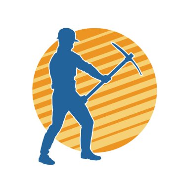 Görev sırasında baltayla dolaşan işçi kostümlü bir adamın silüeti. Bir madencinin hareket halindeki silueti balta aracı ile poz verir.