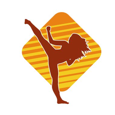 Dövüş sanatları tekmesi atan bir kadının silueti. Sportif bir kadının silueti tekme hareketi yapıyor..