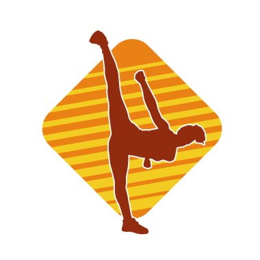 Dövüş sanatları tekmesi atan bir kadının silueti. Sportif bir kadının silueti tekme hareketi yapıyor..