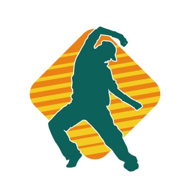 Hareket halindeki bir erkek dansçının silueti. Dans eden zayıf bir adamın silueti..