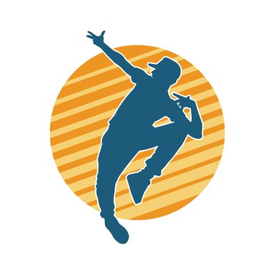 Hareket halindeki bir erkek dansçının silueti. Dans eden zayıf bir adamın silueti..