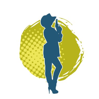 Kovboy kostümü giymiş bir kadın modelin silueti. Silah taşıyan bir kovboy kız silueti..